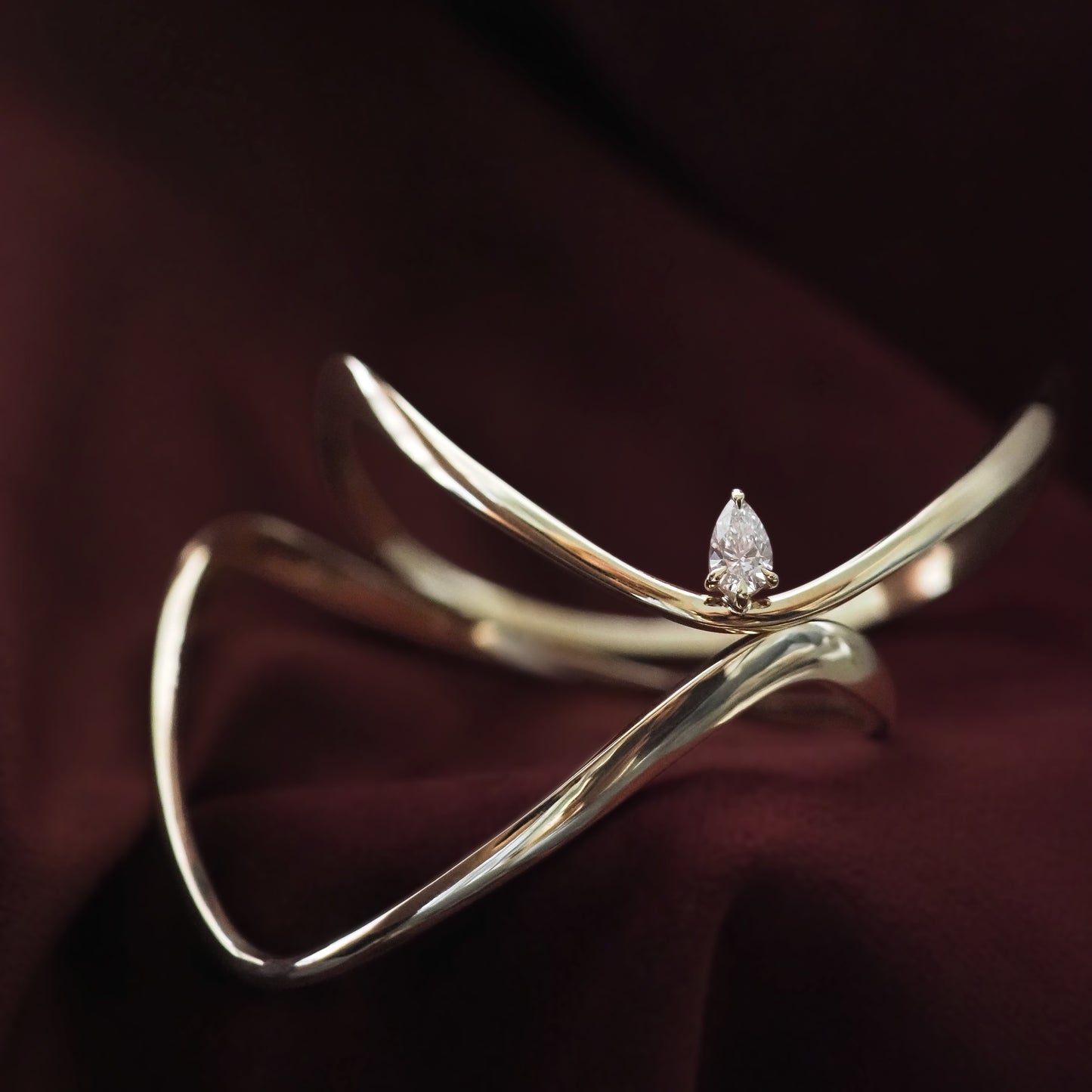 Gold bracelet with a diamond on a dark background
[text overlay: Piece 8—The Sol Bangle (top), Piece 5—The Forme Bangle (bottom)]