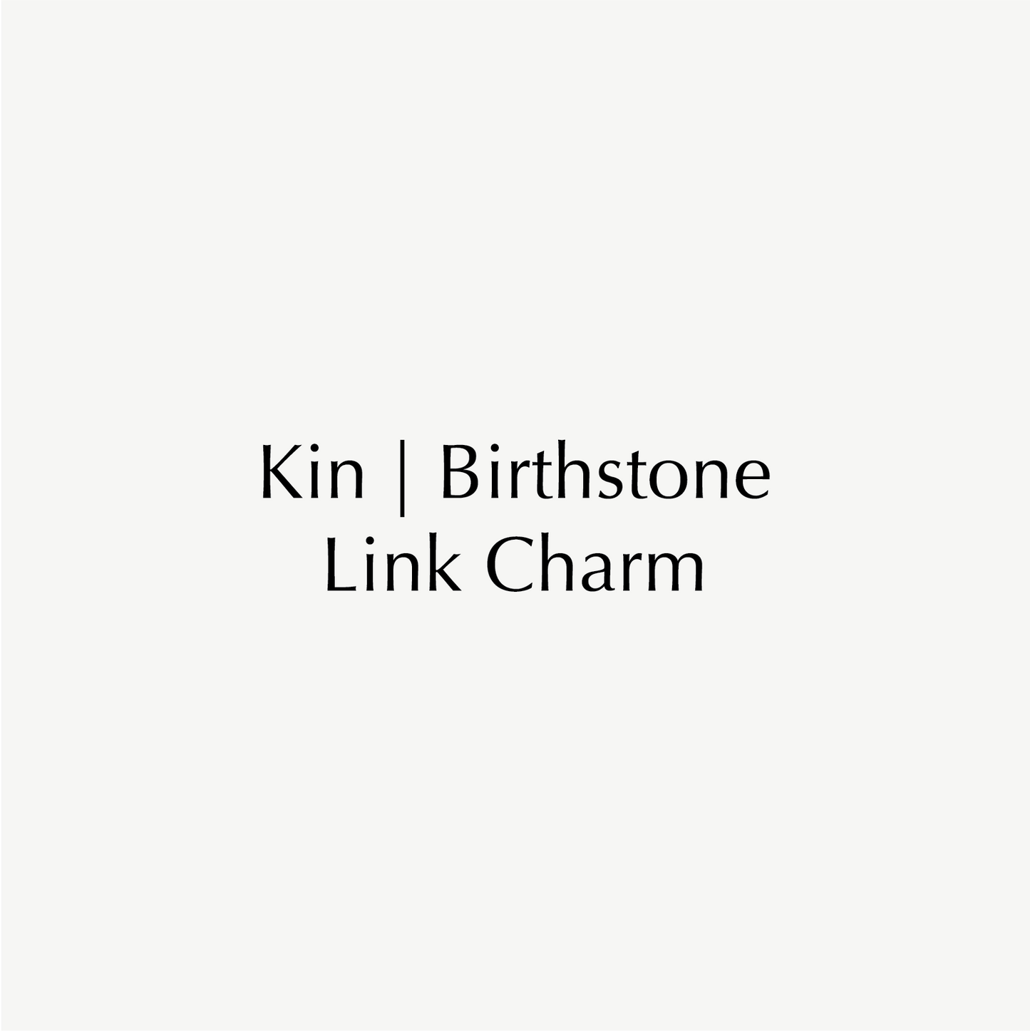 "Kin Birthstone Link Charm text on white background, highlighting luxury jewellery branding."
