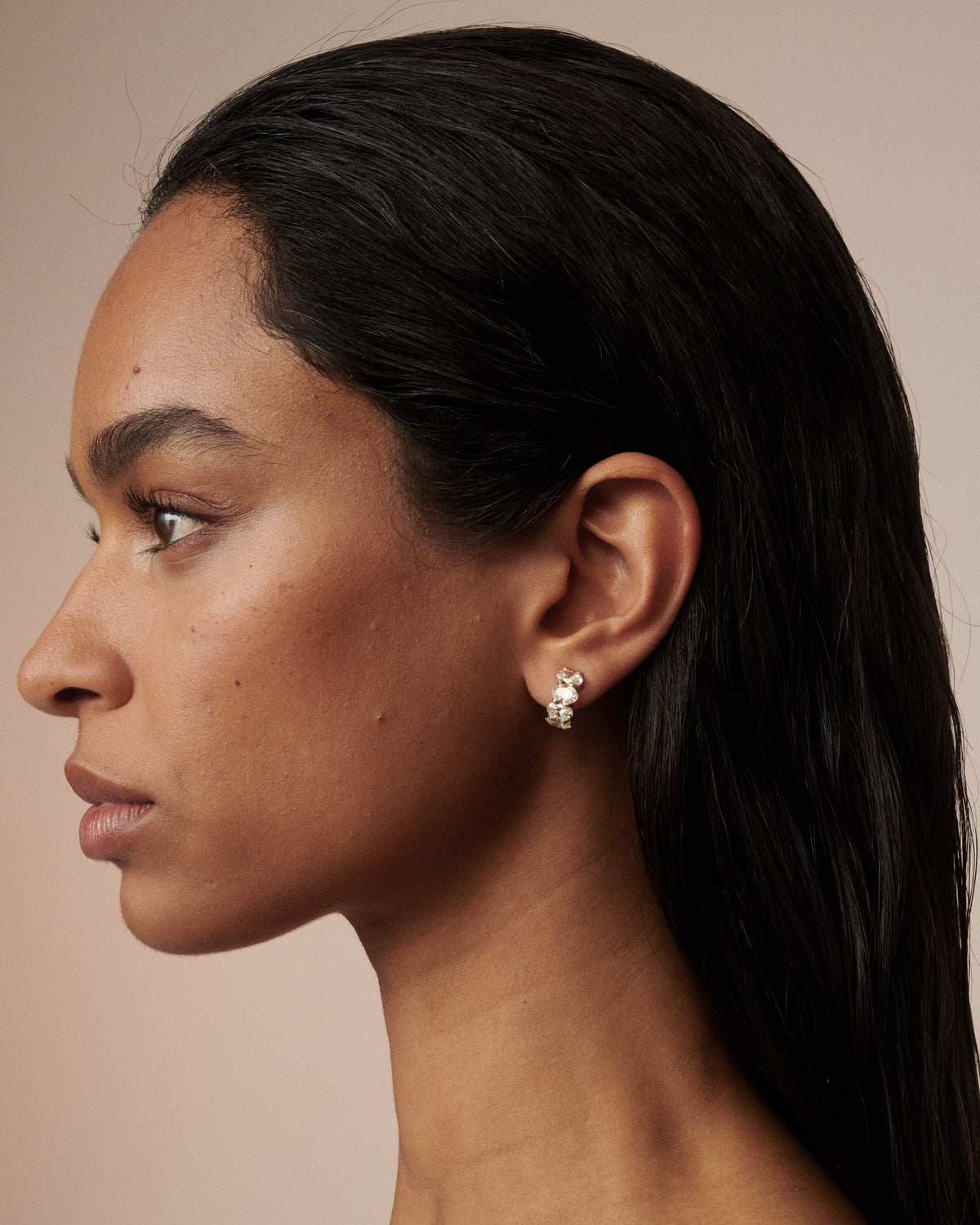 Small oval lab-grown diamond hoop earrings in gold, side view