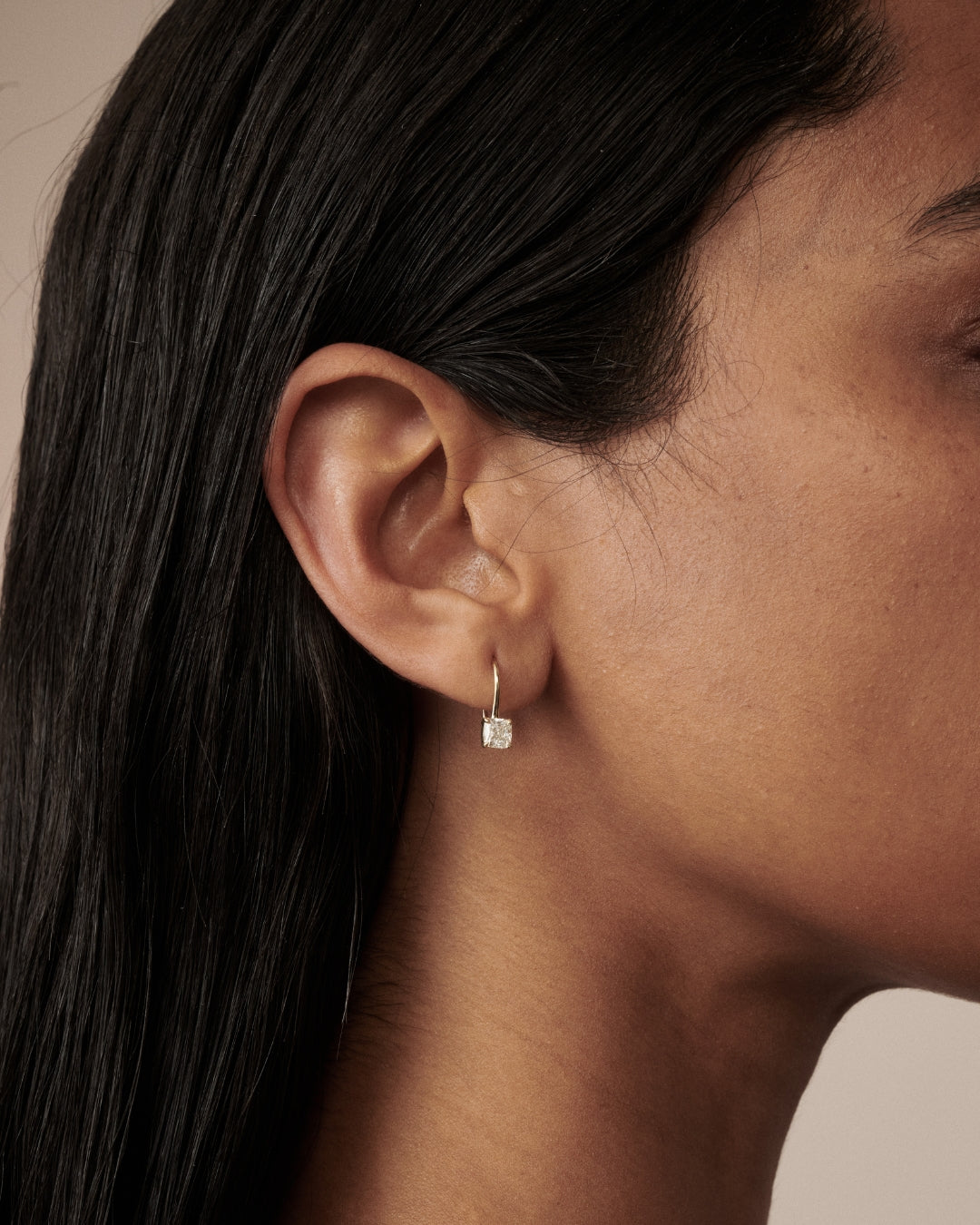 Cushion Hooks as worn by model Franciele shot on a light beige background