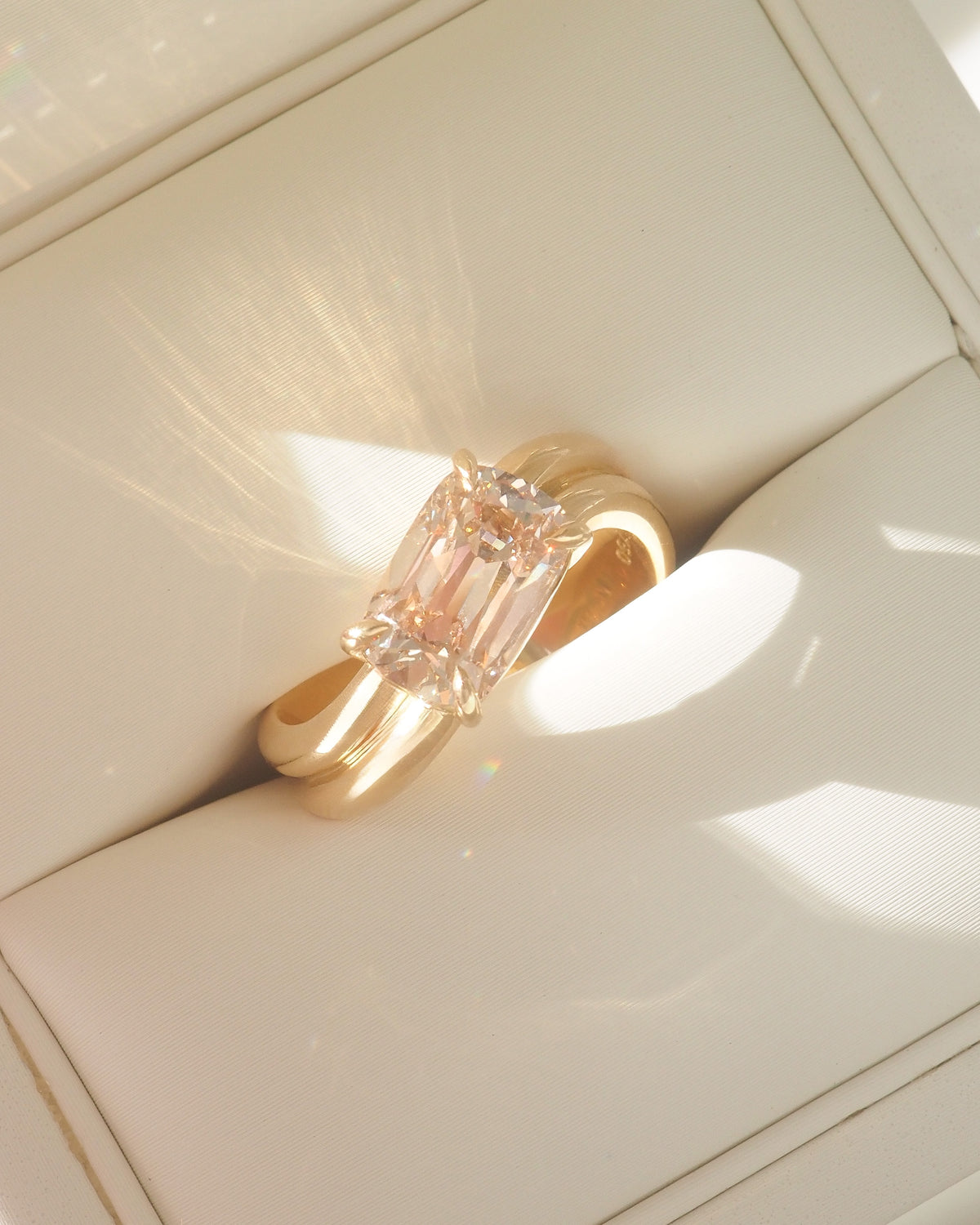 Champagne gold ring with offset lab-grown diamond solitaire, double band detail