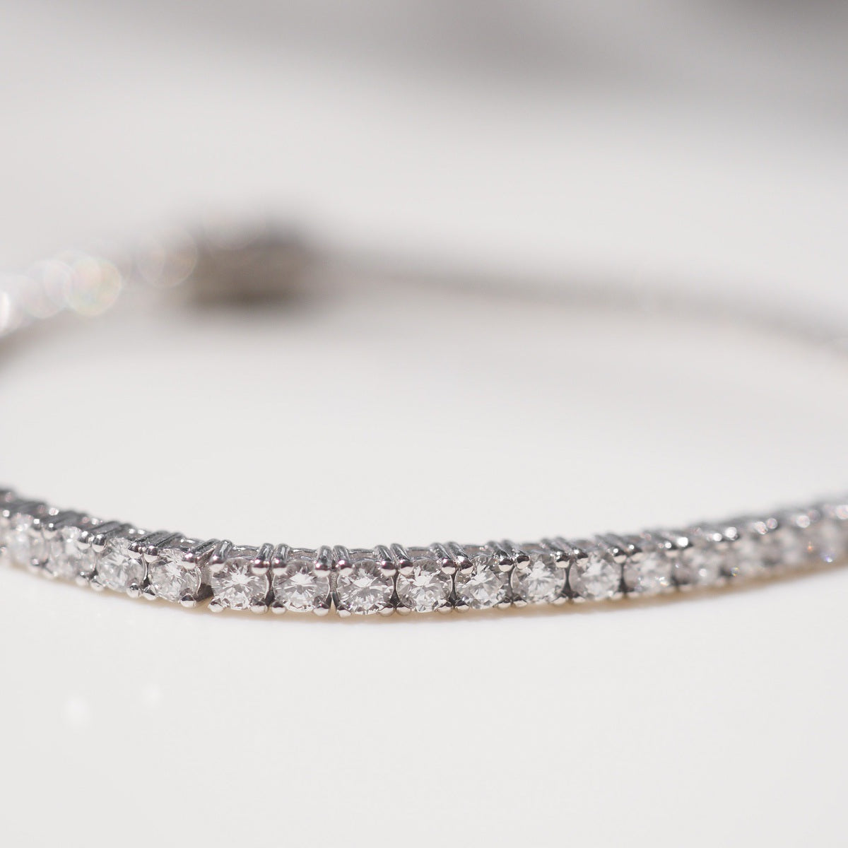 Close-up of a diamond bracelet on a light background