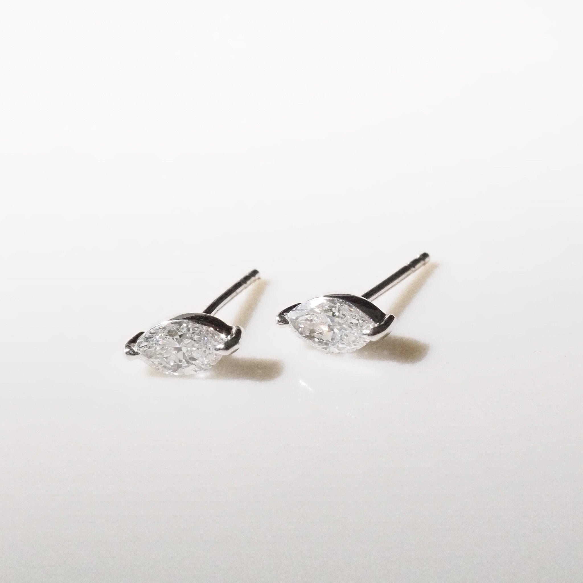 Pair of marquise earrings on a white background