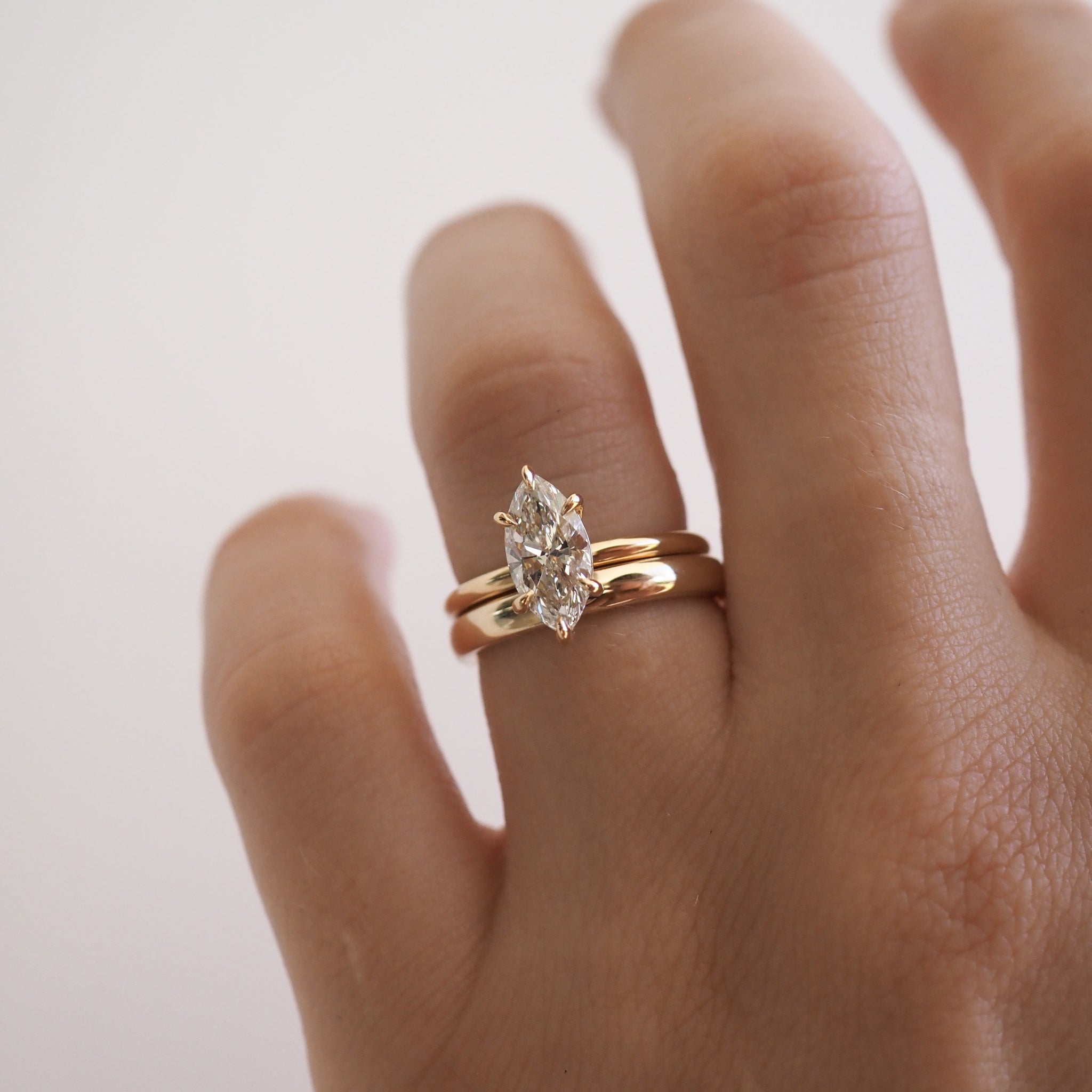 A weighted half-round band in solid 18ct yellow gold.