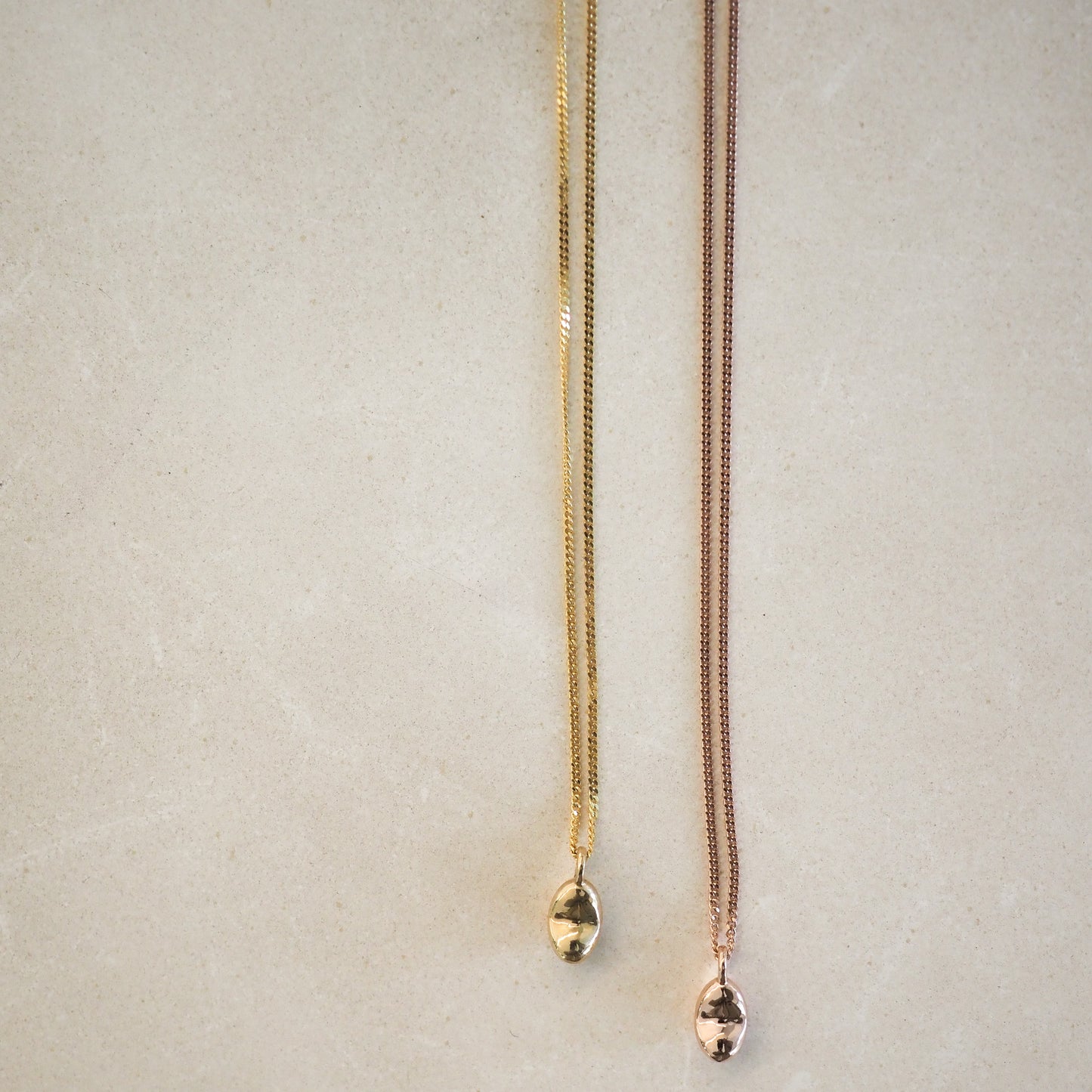 Baby in Time Necklace shown in gold and rose gold, fine jewellery for pregnancy loss