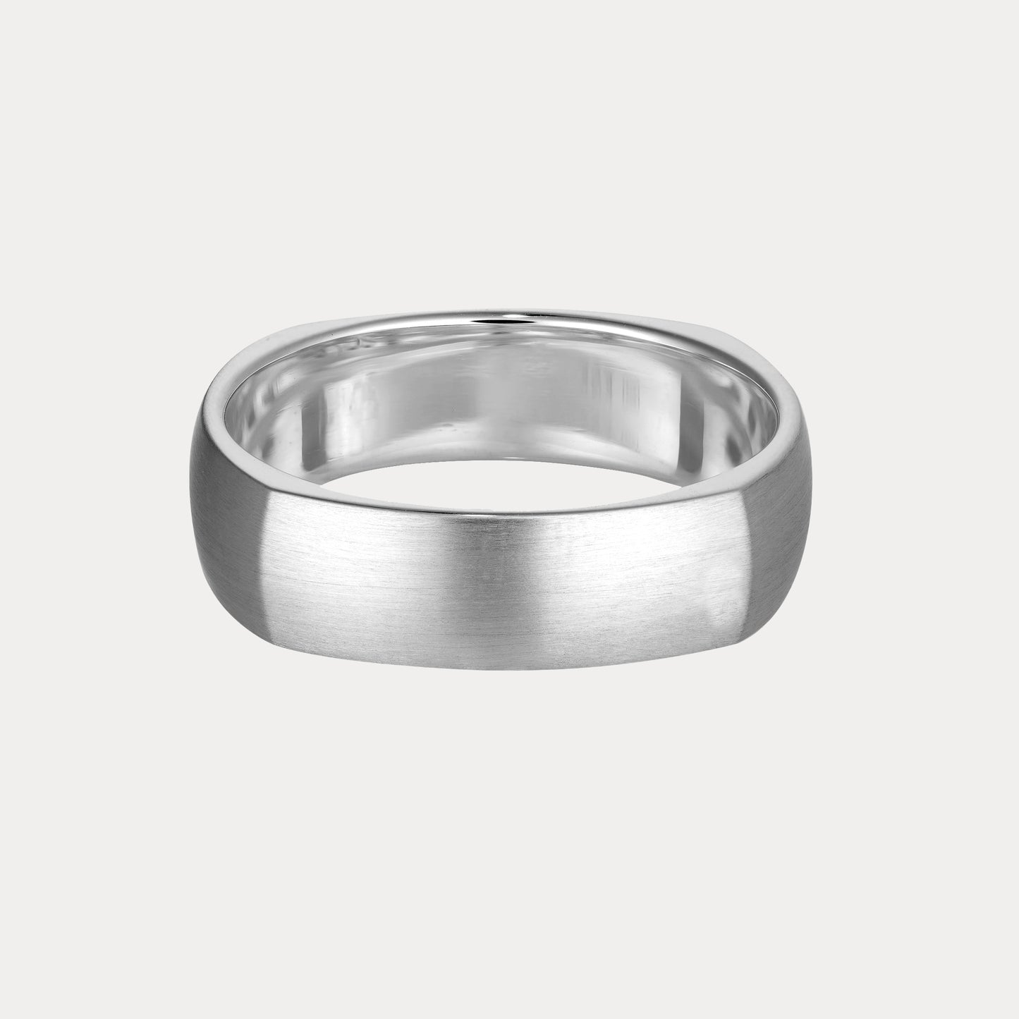 Sleek silver men's ring with a brushed finish on a light grey background, exemplifying luxury jewellery craftsmanship.
